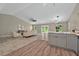 Spacious living and dining area with tile floors and neutral walls at 10545 Parkway Dr, Clermont, FL 34711