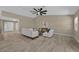 An airy living room featuring neutral tones, tile flooring and modern furniture at 10545 Parkway Dr, Clermont, FL 34711