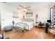 Spacious bedroom featuring hardwood floors, a ceiling fan, and large windows at 11900 Frieth Dr, Orlando, FL 32837