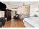 Cozy bedroom with hardwood floors, seating area, and natural light at 11900 Frieth Dr, Orlando, FL 32837