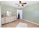 Green bedroom with carpet, ceiling fan, and a light, airy feeling at 11900 Frieth Dr, Orlando, FL 32837