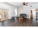 Bright living area showcasing hardwood floors, neutral decor, and access to the backyard at 11900 Frieth Dr, Orlando, FL 32837