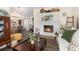Inviting living room with a fireplace, hardwood floors, and comfortable seating at 11900 Frieth Dr, Orlando, FL 32837