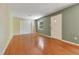 Cozy living room features hardwood floors, natural light, and neutral walls at 12046 Se 135Th Ave, Ocklawaha, FL 32179