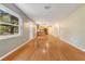 Inviting living area offers hardwood floors and an open floor plan to the kitchen at 12046 Se 135Th Ave, Ocklawaha, FL 32179