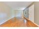 Open floor plan of living room featuring hardwood floors and a double door closet at 12046 Se 135Th Ave, Ocklawaha, FL 32179