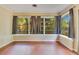 Relaxing sunroom with multiple windows and a view of the surrounding landscape at 12046 Se 135Th Ave, Ocklawaha, FL 32179