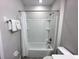 Full bathroom with shower and tub combination and white fixtures at 123 Kenny Blvd, Haines City, FL 33844