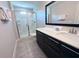 Bathroom with shower, vanity, and dark wood cabinets at 123 Kenny Blvd, Haines City, FL 33844