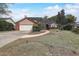 Charming single-Gathering home with a well-maintained lawn, brick accents, and an attached two-car garage at 13 Bass Lake Dr, Debary, FL 32713