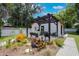Charming backyard with patio, pergola and beautiful landscaping at 1505 Magnolia Ave, Sanford, FL 32771