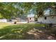Large backyard with a screened-in pool, patio, and lush landscaping at 1505 Magnolia Ave, Sanford, FL 32771