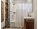 Bathroom with shower and decorative tiled walls and vanity sink at 1505 Magnolia Ave, Sanford, FL 32771