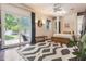 Bright bedroom with large sliding glass doors, wood floors, and access to a lush backyard at 1505 Magnolia Ave, Sanford, FL 32771