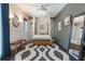 Bright bedroom with large windows, dark wood floors, and stylish decor, seating area, and large rug at 1505 Magnolia Ave, Sanford, FL 32771