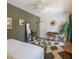 Bright bedroom with large windows, dark wood floors, stylish decor, with an adjacent office space at 1505 Magnolia Ave, Sanford, FL 32771