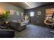 Flex space includes a sofa and custom painted brick wall at 1505 Magnolia Ave, Sanford, FL 32771