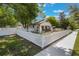 Home showcasing a white picket fence, landscaped yard, and inviting exterior, enhancing its curb appeal at 1505 Magnolia Ave, Sanford, FL 32771