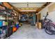 Cluttered garage filled with various items, offering potential storage and workspace at 1505 Magnolia Ave, Sanford, FL 32771