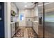 Well-lit kitchen featuring stainless steel appliances, white cabinets and modern countertops at 1505 Magnolia Ave, Sanford, FL 32771