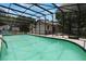 Beautiful in-ground pool and screen enclosure offer great views of the property's landscaping at 1505 Magnolia Ave, Sanford, FL 32771