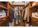 Large, fully organized walk-in closet with shelves, drawers, hanging rods, and ample storage space at 1505 Magnolia Ave, Sanford, FL 32771