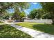 Expansive yard featuring a well-manicured lawn, white picket fence, and ample space for outdoor activities at 1505 Magnolia Ave, Sanford, FL 32771