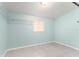 Minimalist bedroom with tile floors, offering a clean and serene living space at 16 Lake Drive, Debary, FL 32713