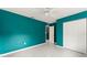 A spacious bedroom with gray tile floors and a closet, offering plenty of storage at 16 Lake Drive, Debary, FL 32713