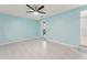 Inviting bedroom with tile floors, a ceiling fan, and a bright, airy ambiance at 16 Lake Drive, Debary, FL 32713