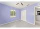 A bright bedroom with a closet features neutral floors and one window at 16 Lake Drive, Debary, FL 32713