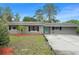 Charming single-story home featuring a well-maintained lawn and a tidy, inviting exterior at 16 Lake Drive, Debary, FL 32713