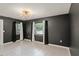 Living room featuring modern lighting and bright windows at 16 Lake Drive, Debary, FL 32713