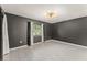 Inviting living room featuring contemporary lighting and tile flooring at 16 Lake Drive, Debary, FL 32713