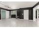Well-lit living room features tile flooring, a modern ceiling fan, and neutral decor at 16 Lake Drive, Debary, FL 32713