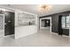 Bright living room showcasing the updated kitchen with granite countertops at 16 Lake Drive, Debary, FL 32713