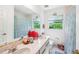 Bathroom with double sink, framed mirror, and a shower tub at 16249 Se 162Nd Ct, Weirsdale, FL 32195