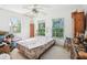 A bedroom with two windows, a ceiling fan, and a mattress at 16249 Se 162Nd Ct, Weirsdale, FL 32195