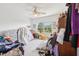 Cluttered bedroom with personal items scattered and furniture needing rearrangement at 16249 Se 162Nd Ct, Weirsdale, FL 32195