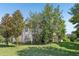 A beautiful two-story house with trees and lawn in the front yard at 16249 Se 162Nd Ct, Weirsdale, FL 32195