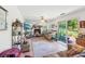 Comfortable living room with a sliding glass door and plenty of natural light at 16249 Se 162Nd Ct, Weirsdale, FL 32195