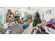 Living room view showing clutter and disorganized living space at 16249 Se 162Nd Ct, Weirsdale, FL 32195