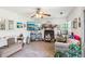 Cozy living room featuring tile flooring, a fireplace, and lots of decor at 16249 Se 162Nd Ct, Weirsdale, FL 32195