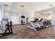 Spacious gym with modern treadmills and fitness machines, complemented by natural light from large windows at 1800 Coriander Dr, Kissimmee, FL 34759