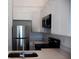 Contemporary kitchen with white cabinetry, stainless steel appliances, and bright countertops at 1800 Coriander Dr, Kissimmee, FL 34759