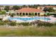 Stunning aerial view of a large community pool and surrounding lush landscaping, perfect for relaxation at 1800 Coriander Dr, Kissimmee, FL 34759