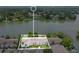Aerial view of condo complex adjacent to lake and surrounded by lush landscaping at 200 Maitland Ave # 122, Altamonte Springs, FL 32701
