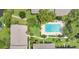 Aerial shot of the community pool for condominium residents surrounded by lush landscaping at 200 Maitland Ave # 122, Altamonte Springs, FL 32701