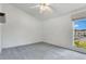 Neutral bedroom with ceiling fan, carpet and window at 200 Maitland Ave # 122, Altamonte Springs, FL 32701