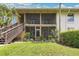 A condominium building with stairway access to screened in patios and meticulous landscaping at 200 Maitland Ave # 122, Altamonte Springs, FL 32701